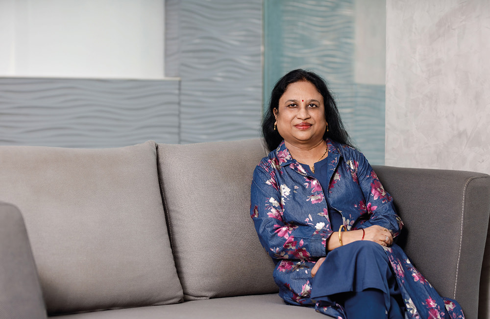 Portrait of Pratima Srivastava, PhD, Aragen employee, seated on a sofa
