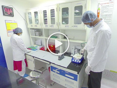 Virtual tour: two Aragen staff in gowns and caps working in the vivarium (video)