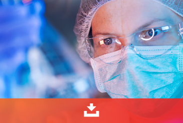 Scientist in surgical cap, mask and safety glasses in a blue-lit lab, physical form selection case study download