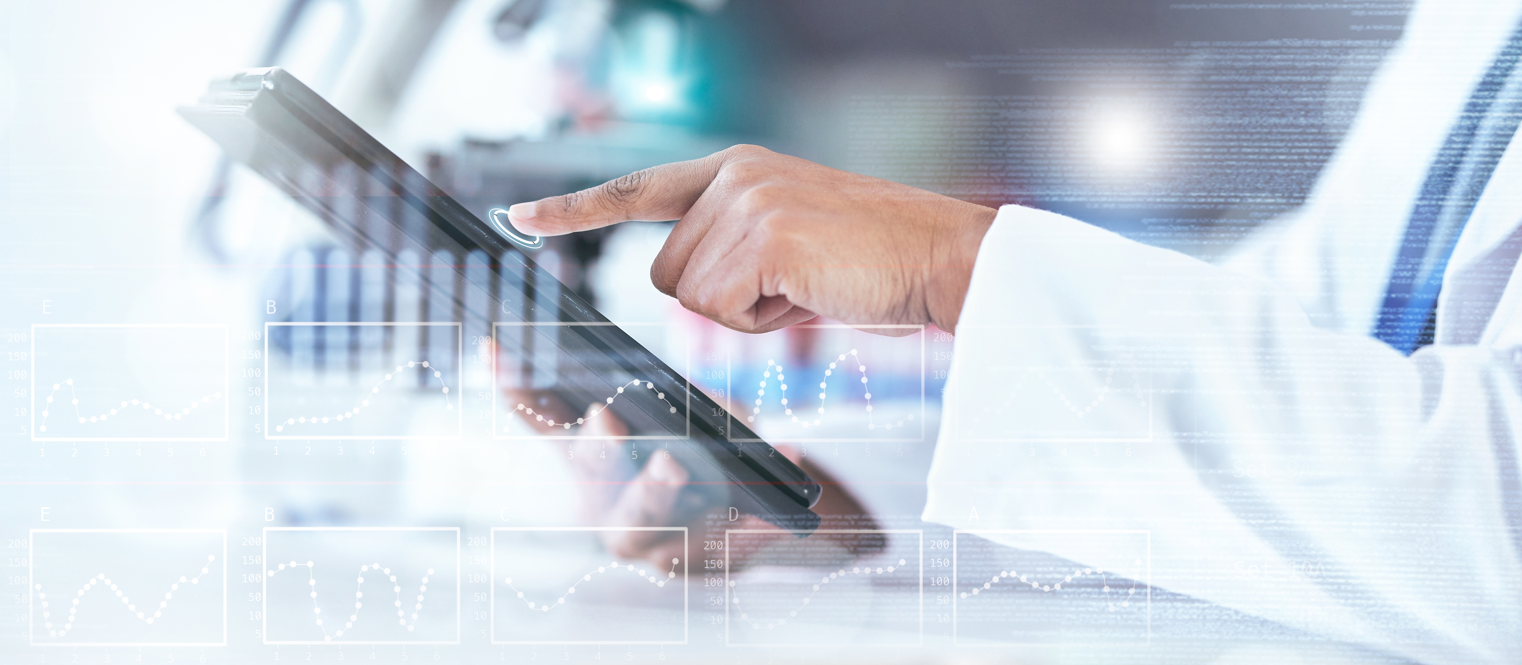 Scientist's hand touching a tablet screen with a chart overlay, representing design of experiments