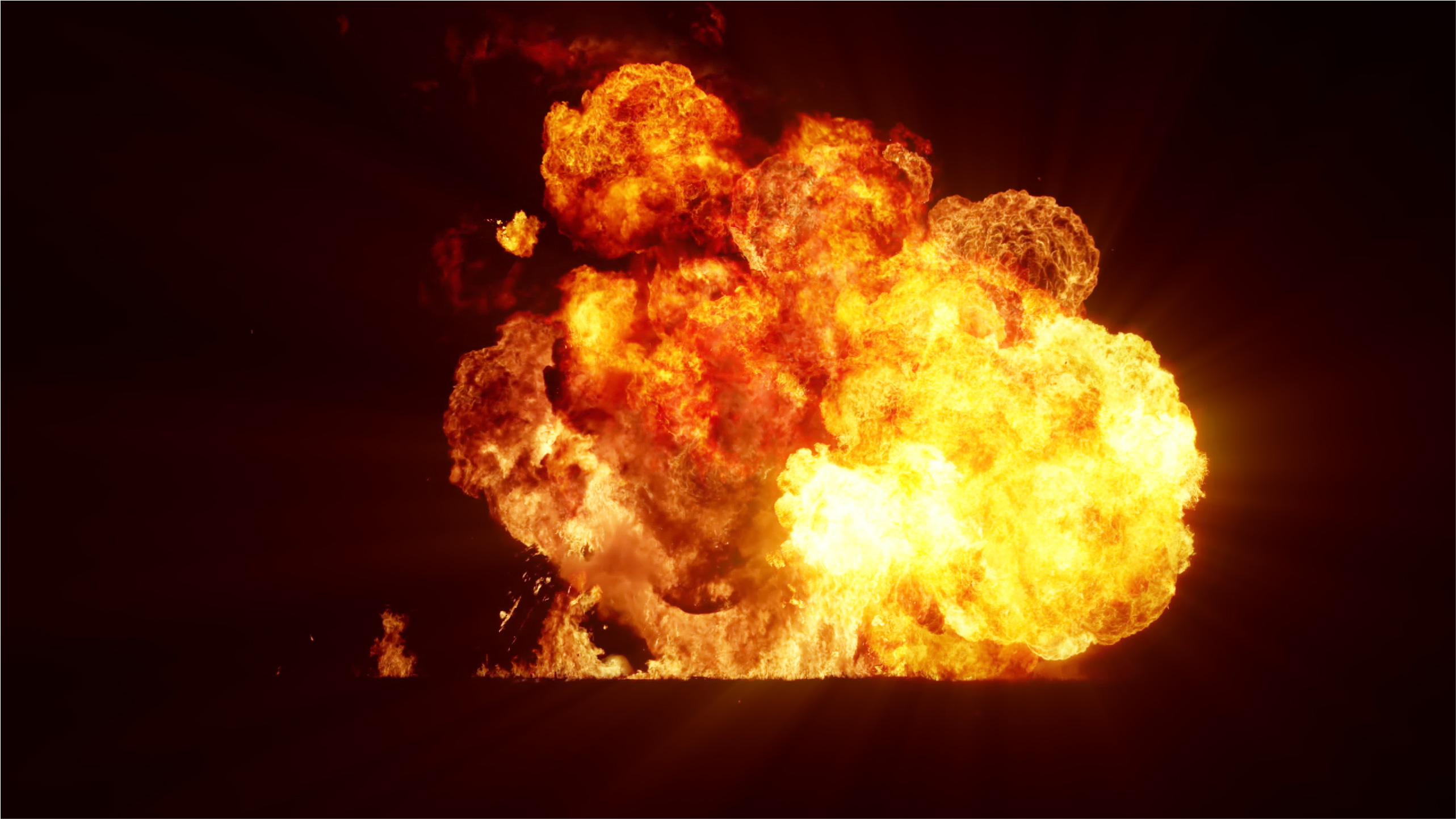 Large fireball explosion against a black background, representing dust explosion testing