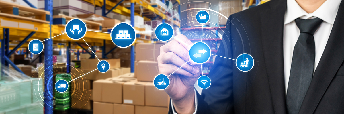 Businessperson in a warehouse interacting with holographic supply chain icons, representing strategic supply chain management